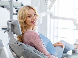 Closeup of smiling patient sitting in treatment chair