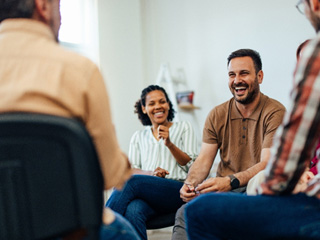 People sitting together talking and laughing