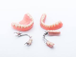two full dentures in McComb and two partials 