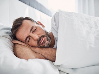 Man sleeping in bed
