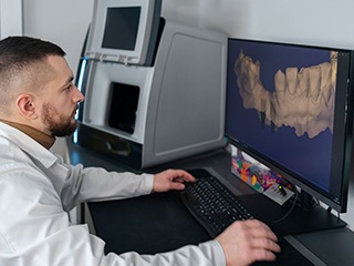 Dentist looking at patient’s X-rays