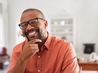 Man with dental implants in McComb smiling