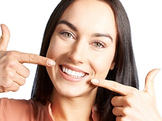 Woman with an attractive smile after laser dentistry.