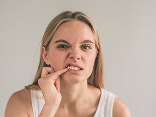 Woman wonders “why are my gums bleeding?”