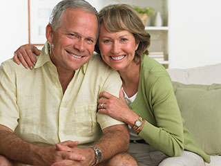 husband and wife smiling together