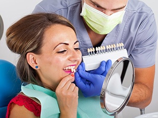 woman trying on porcelain veneers in McComb