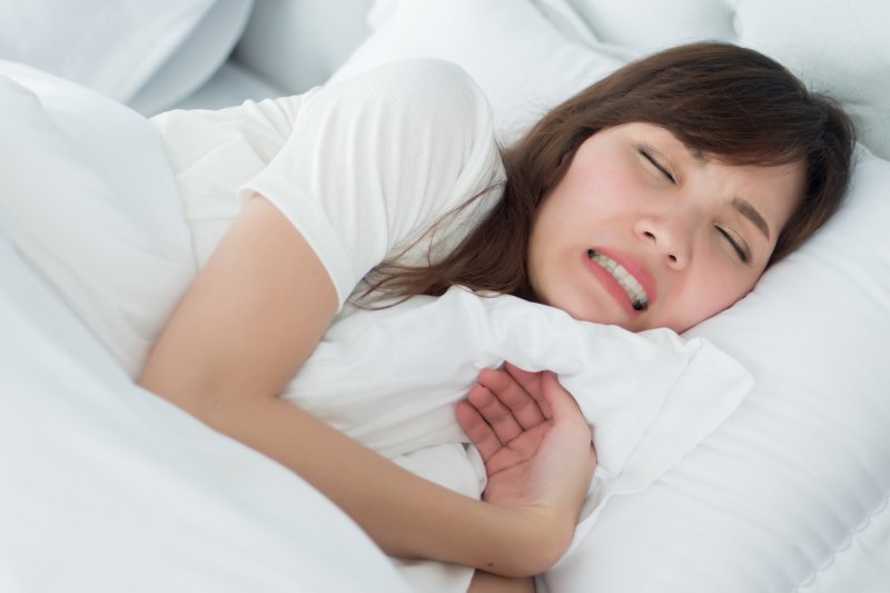 young woman teeth grinding while she sleeps